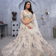 Graceful White Net Lehenga with Intricate Bel Butti Work Blouse & Dupatta Set - Buy_1
