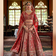 Luxurious Red Paisley Pattern Silk Lehenga with Sequin, Pearl & Zari Detailing Complete with Blouse & Dual Dupatta - Buy